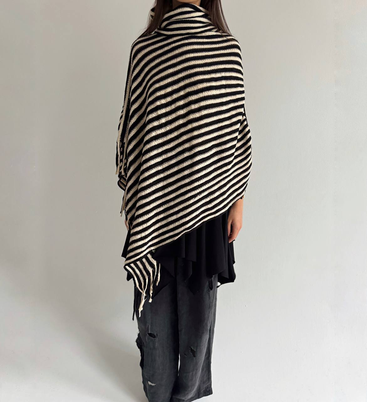Striped poncho with tassels