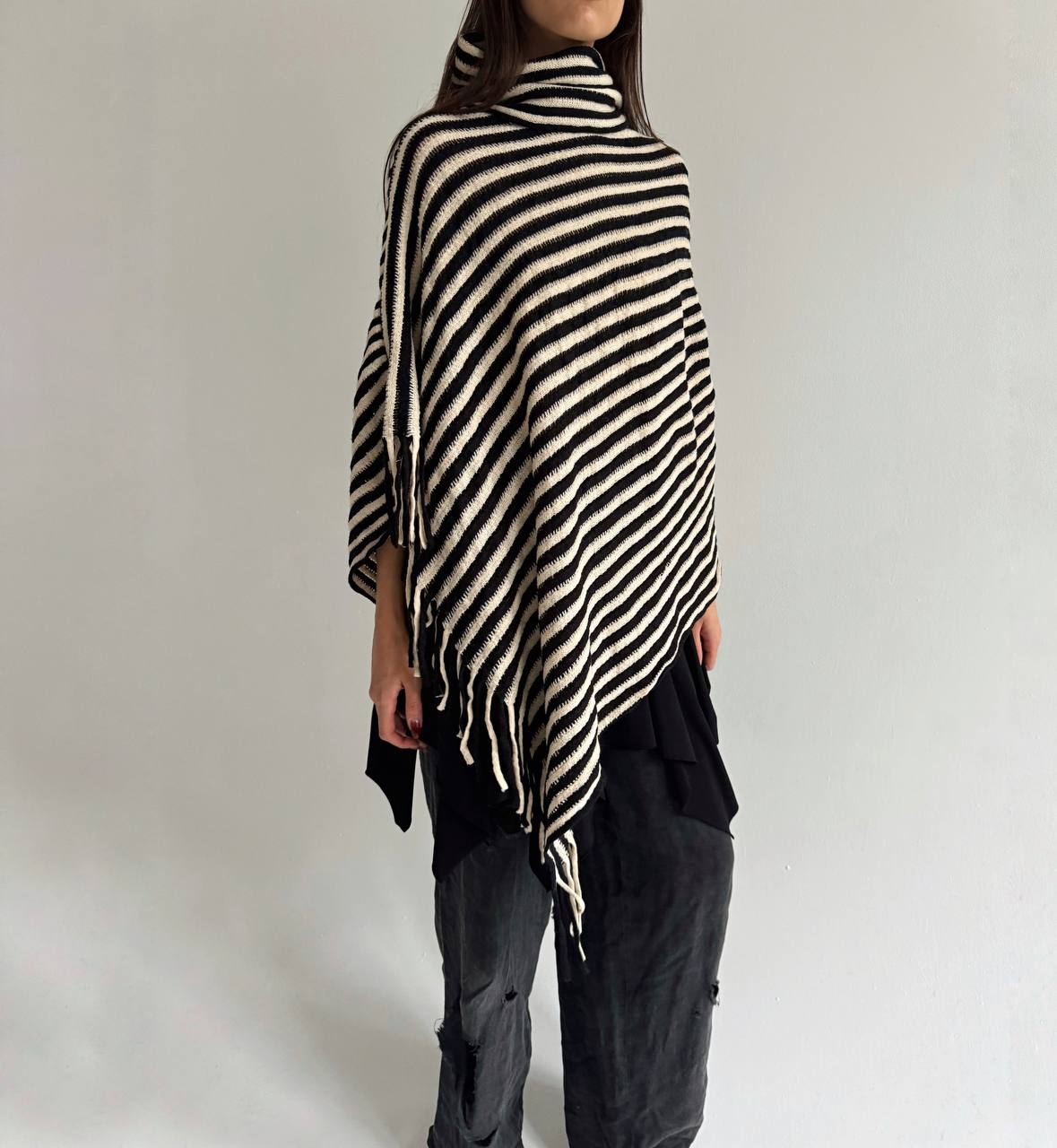 Striped poncho with tassels