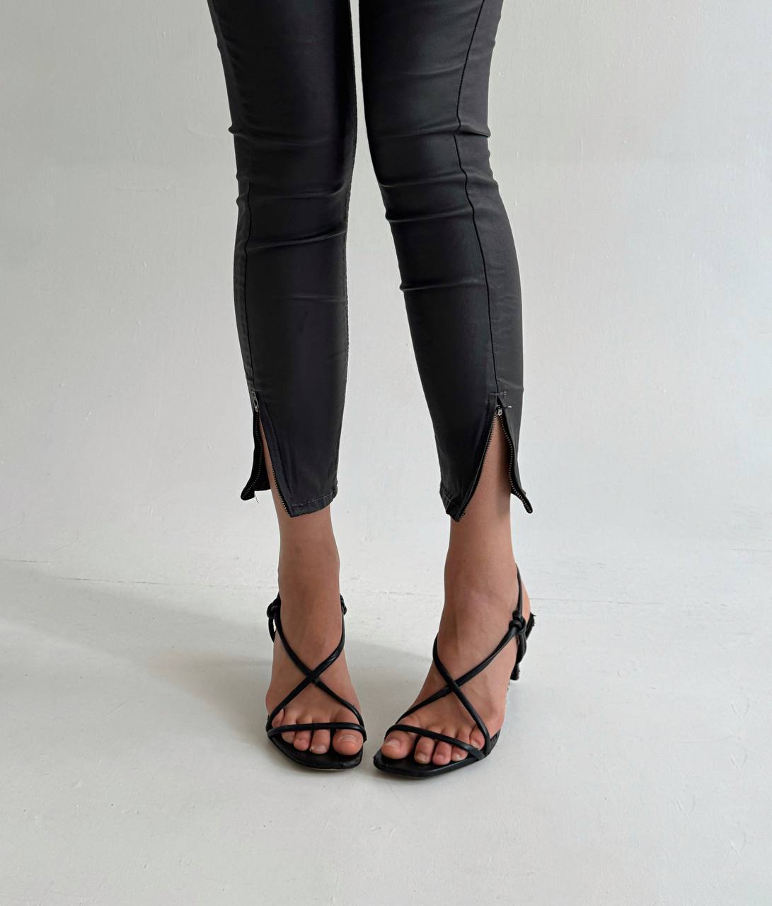 Black wax skinny jeans