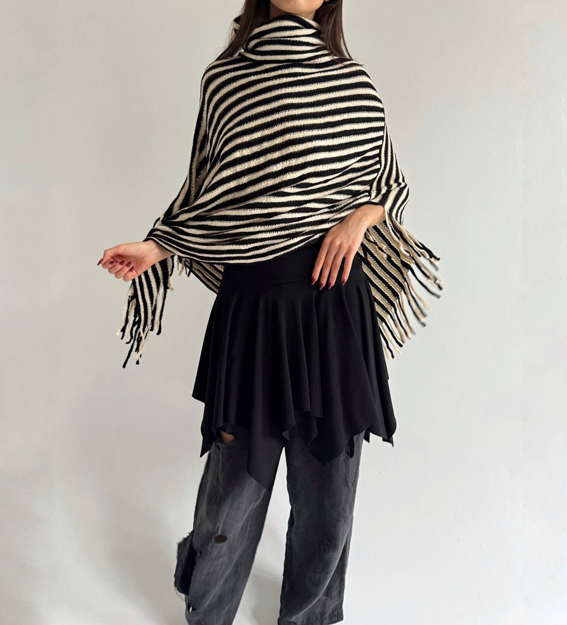 Striped poncho with tassels
