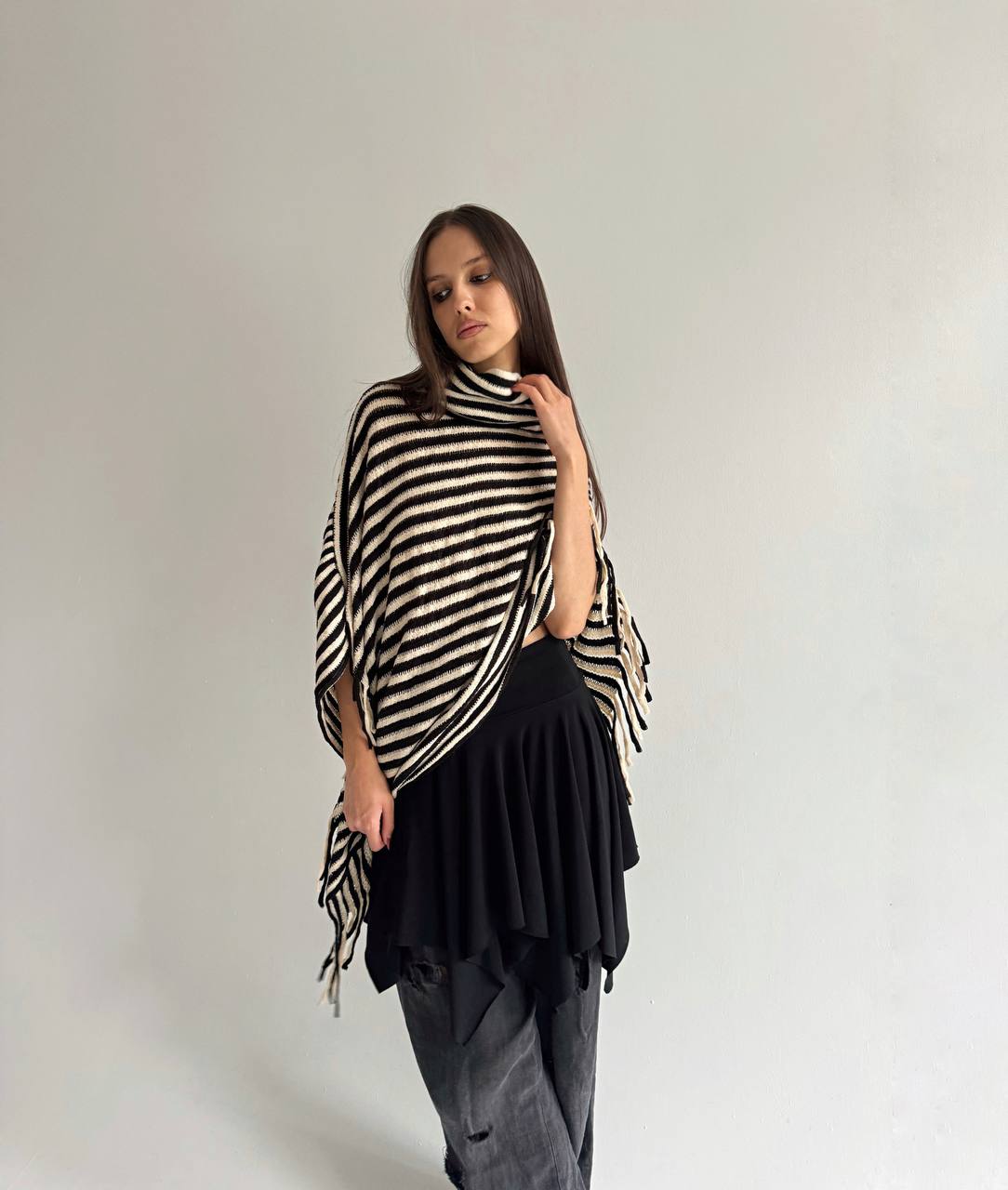 Striped poncho with tassels