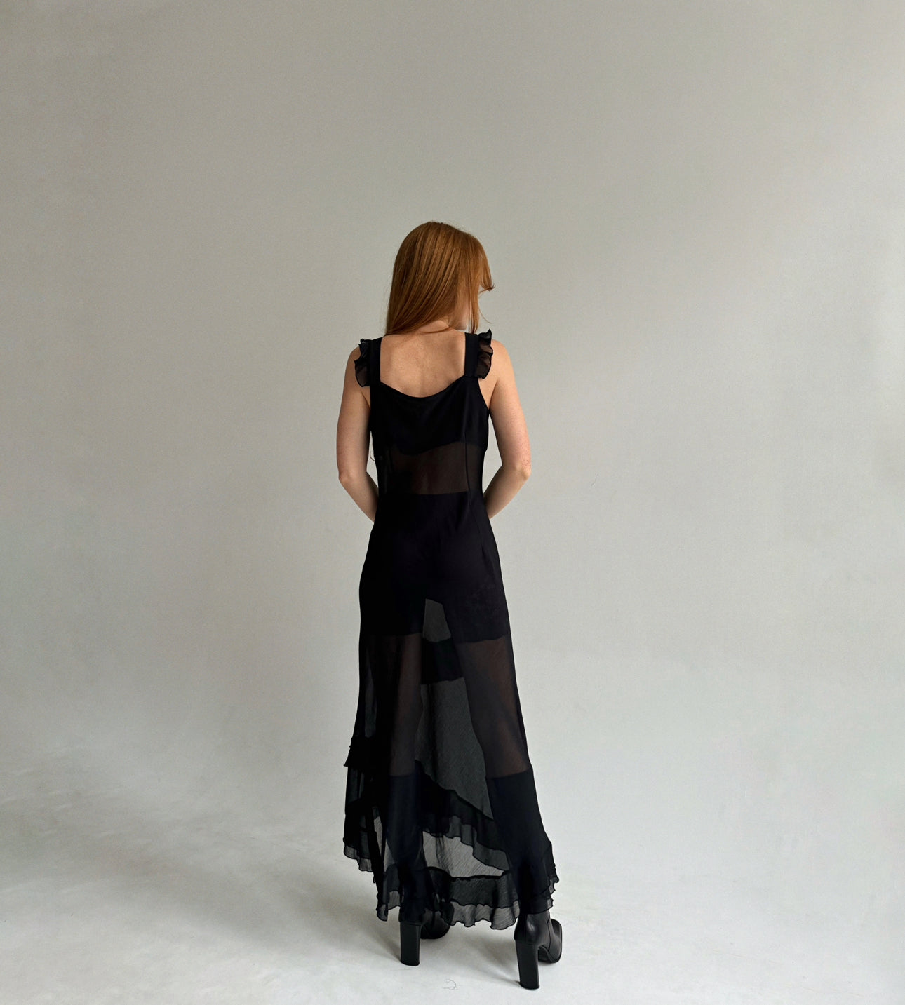 Vintage black maxi dress with asymmetrical ruffled bottom trim