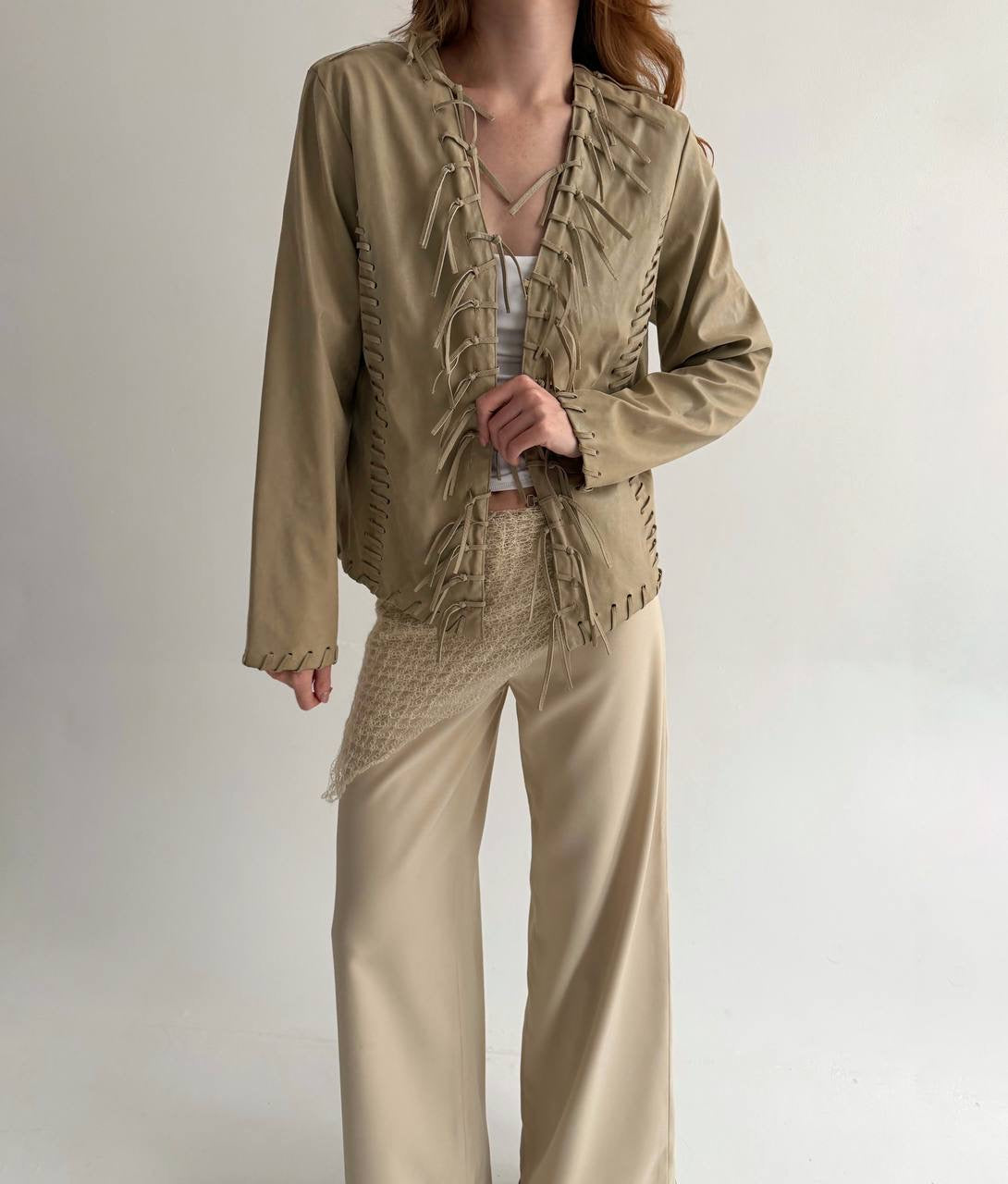 Vintage beige faux leather jacket with fringe detailing