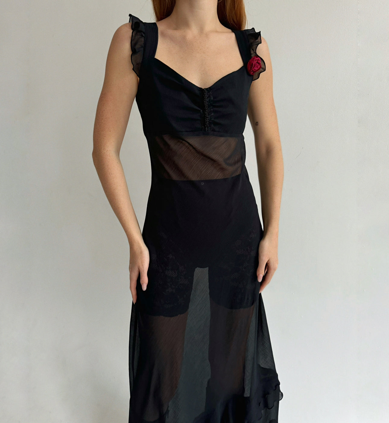 Vintage black maxi dress with asymmetrical ruffled bottom trim