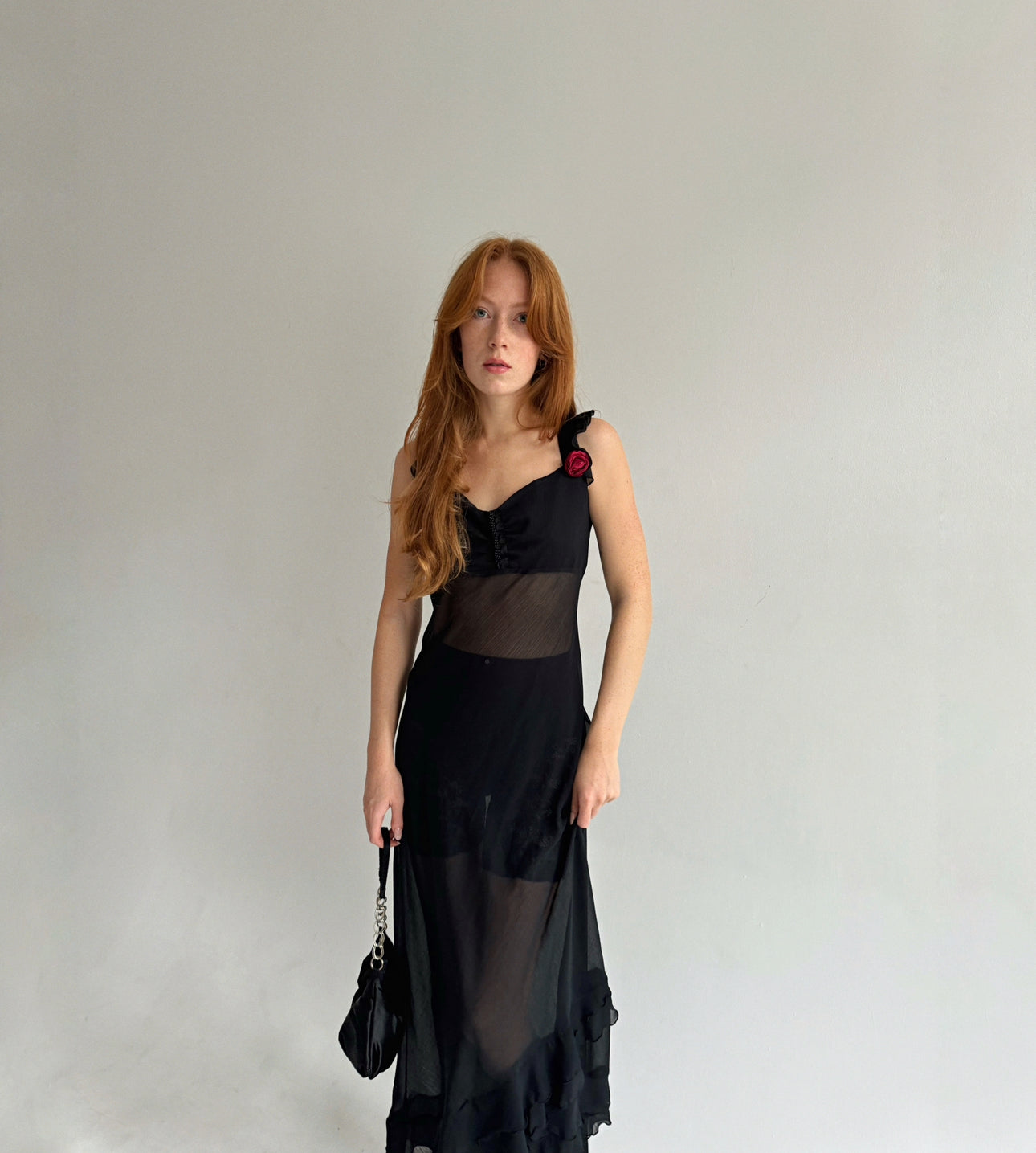 Vintage black maxi dress with asymmetrical ruffled bottom trim