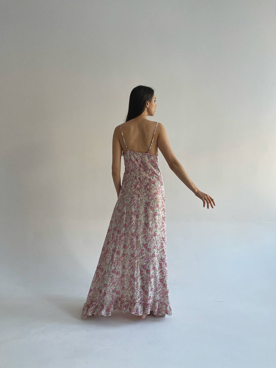 Long maxi dress with pink flower pattern and ruched bottom