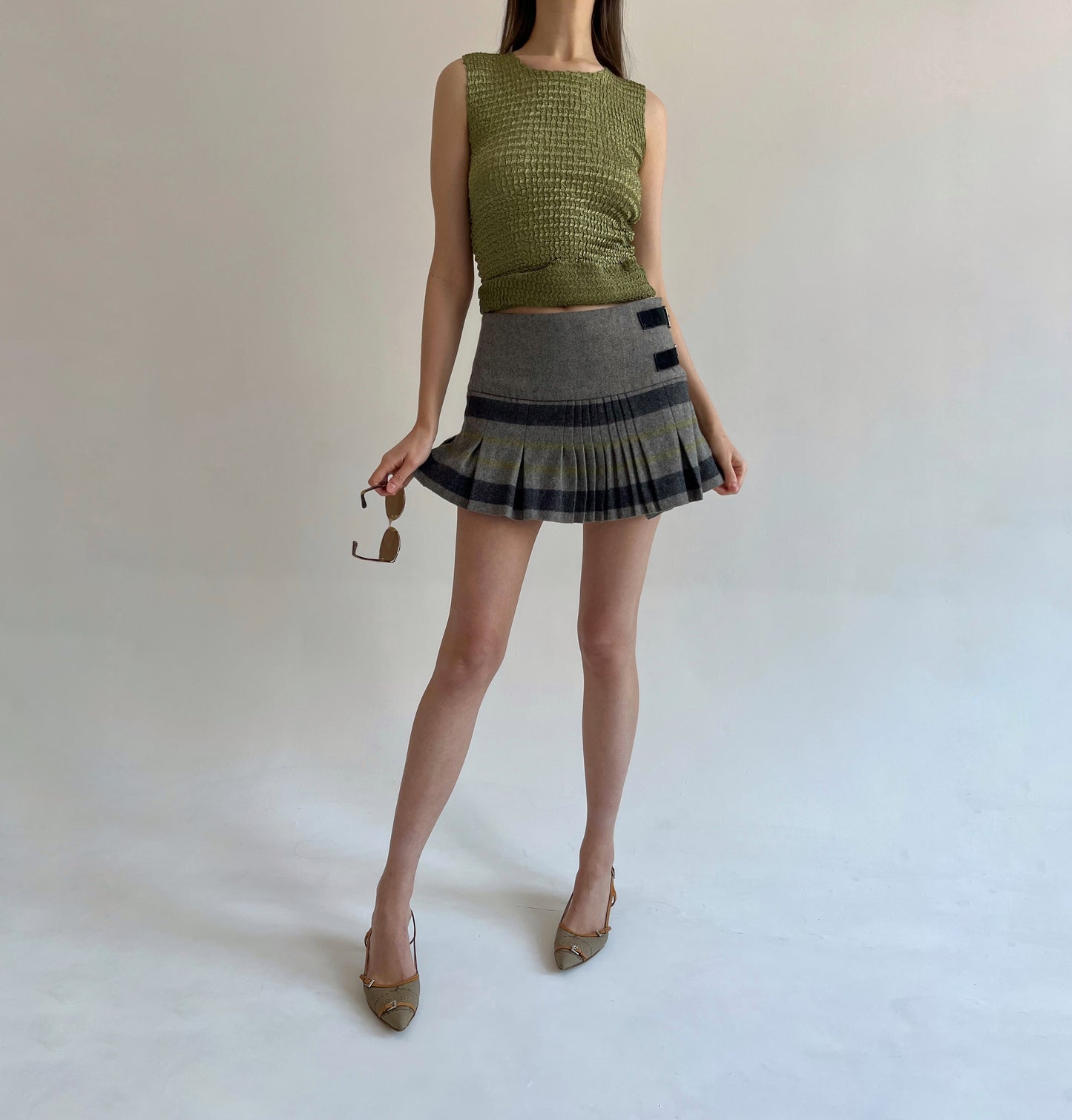 Wool blend pleated mini skirt with side belts detail