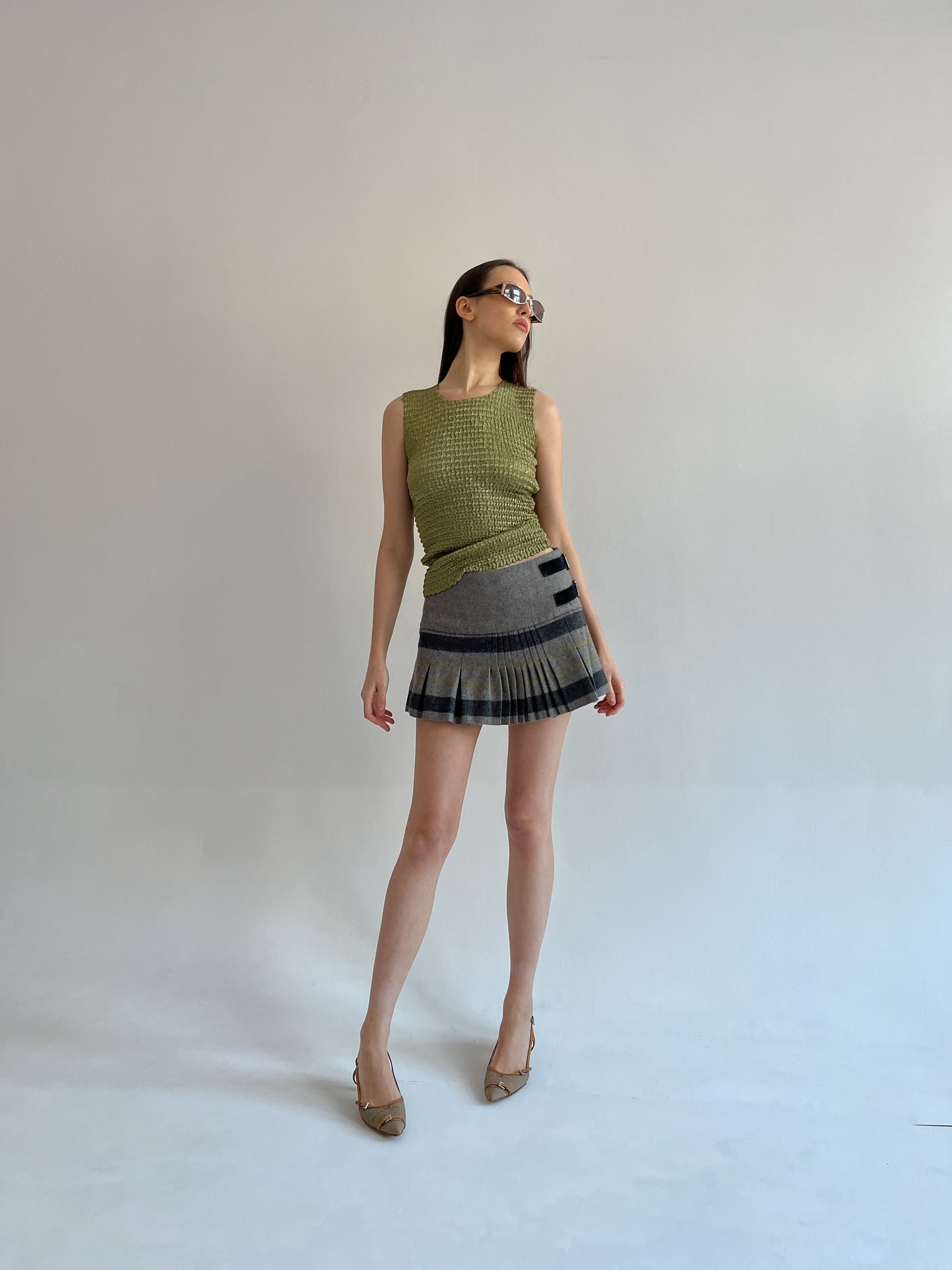 Wool blend pleated mini skirt with side belts detail