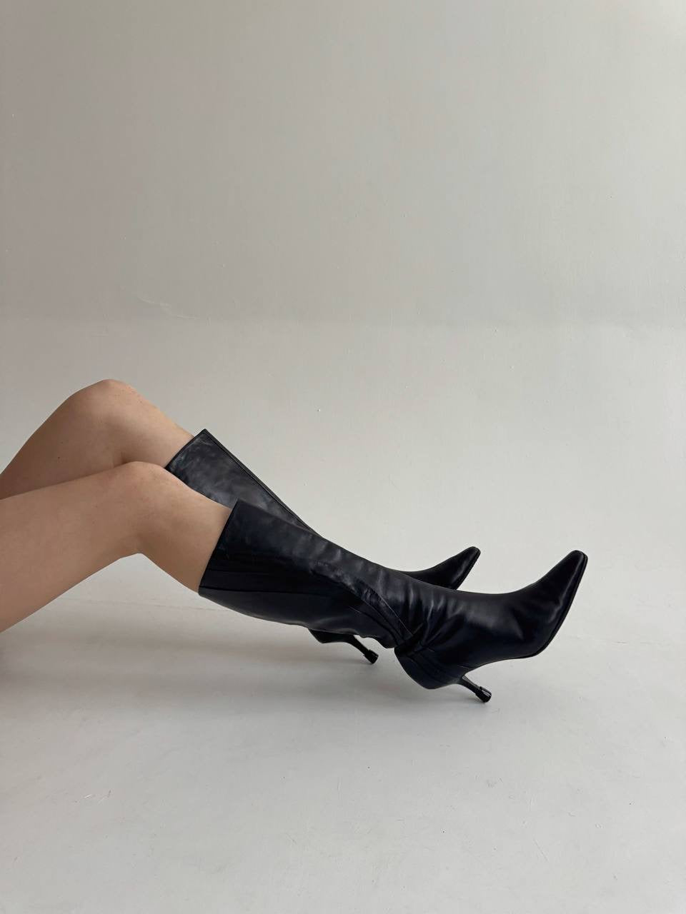 Vintage black faux leather knee high pointy boots