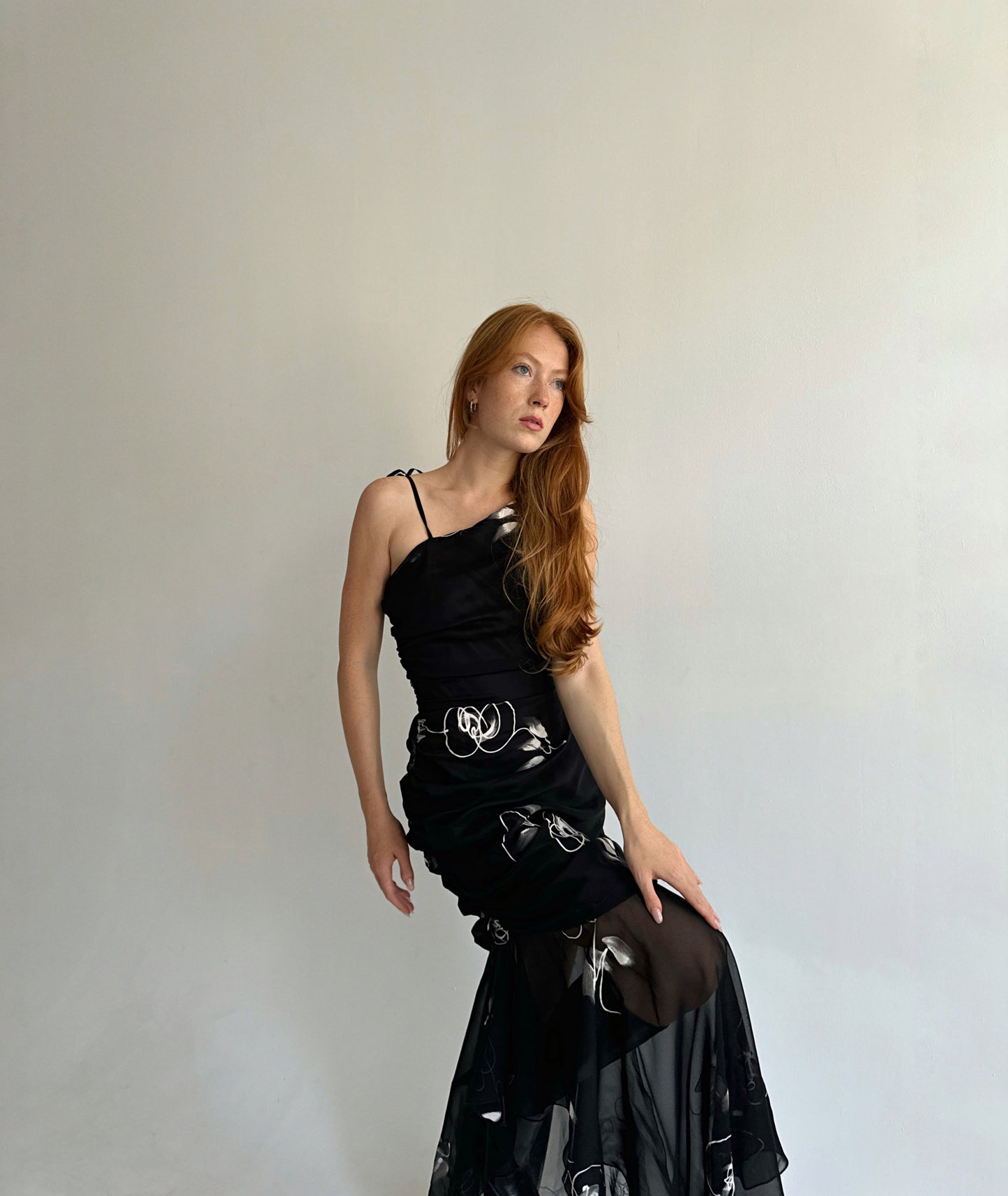 Vintage black asymmetrical maxi dress with a print, gathering and mesh bottom