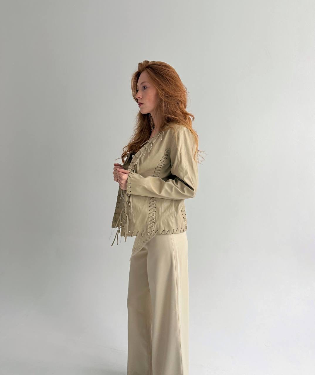Vintage beige faux leather jacket with fringe detailing