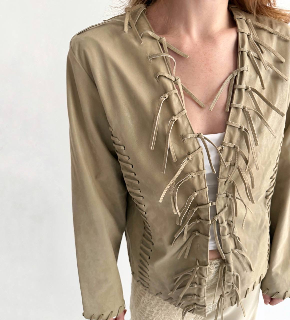 Vintage beige faux leather jacket with fringe detailing