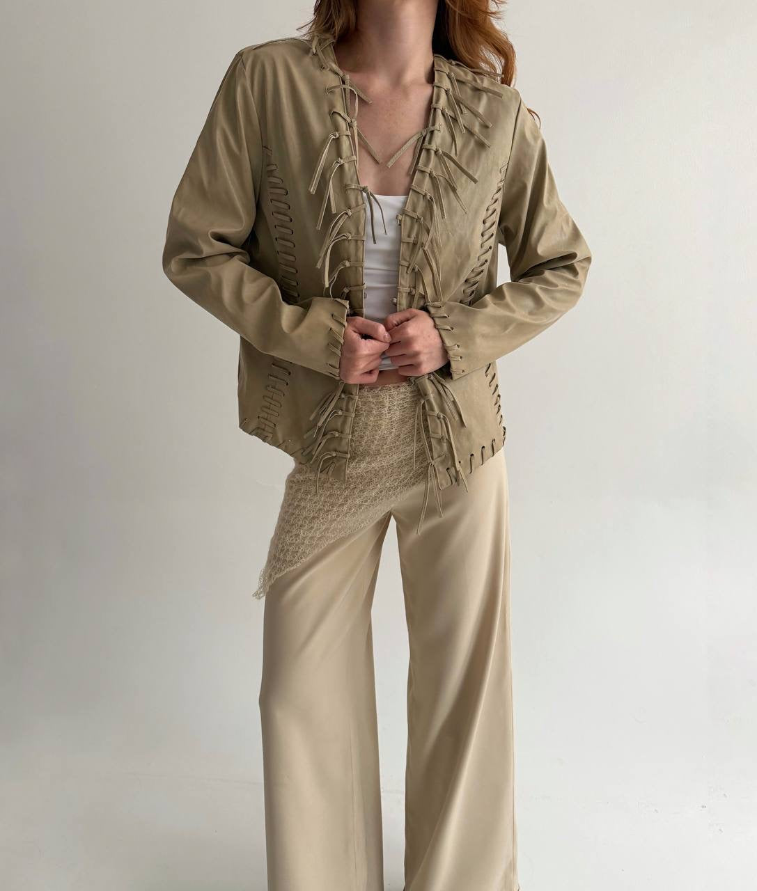 Vintage beige faux leather jacket with fringe detailing