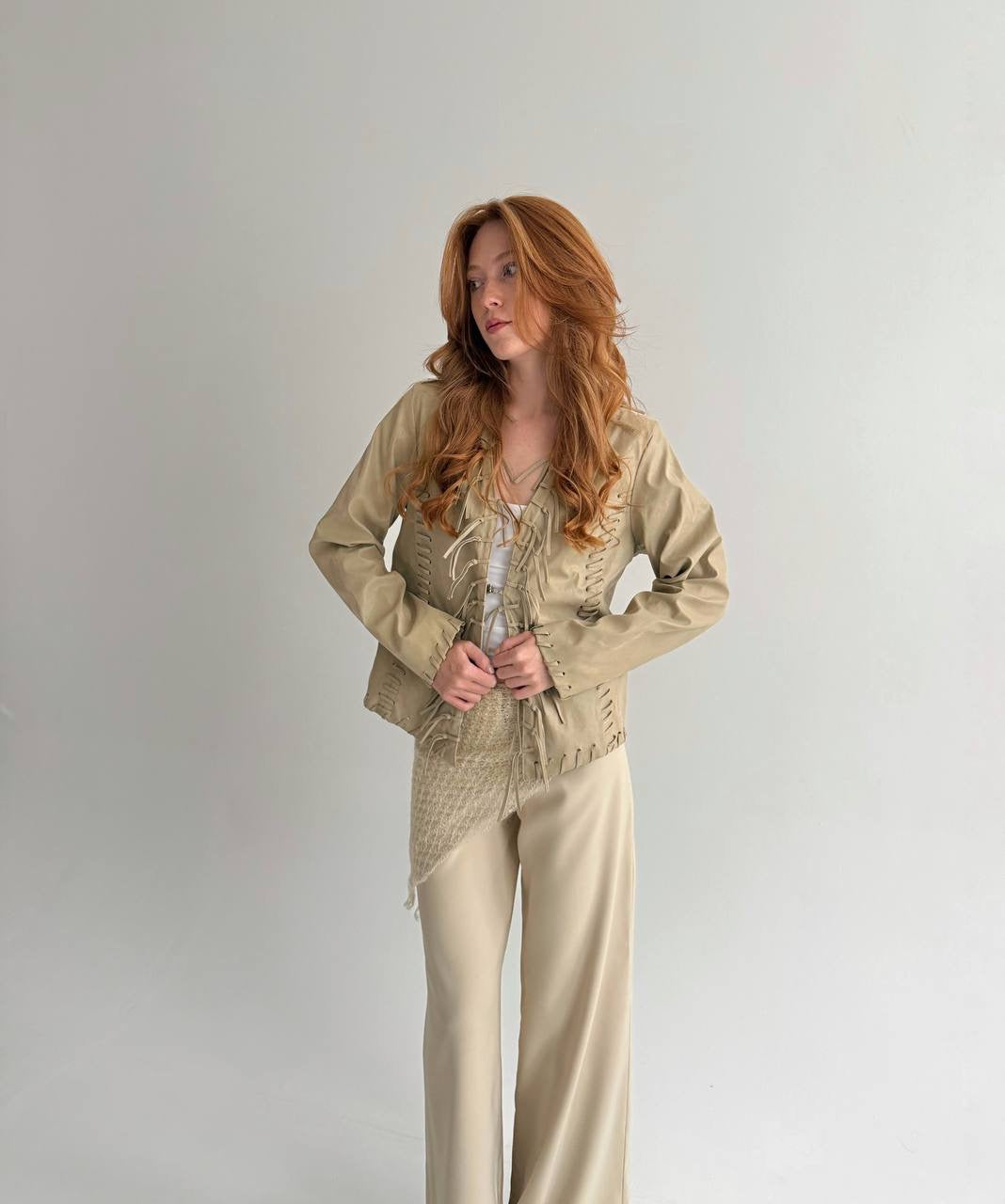 Vintage beige faux leather jacket with fringe detailing