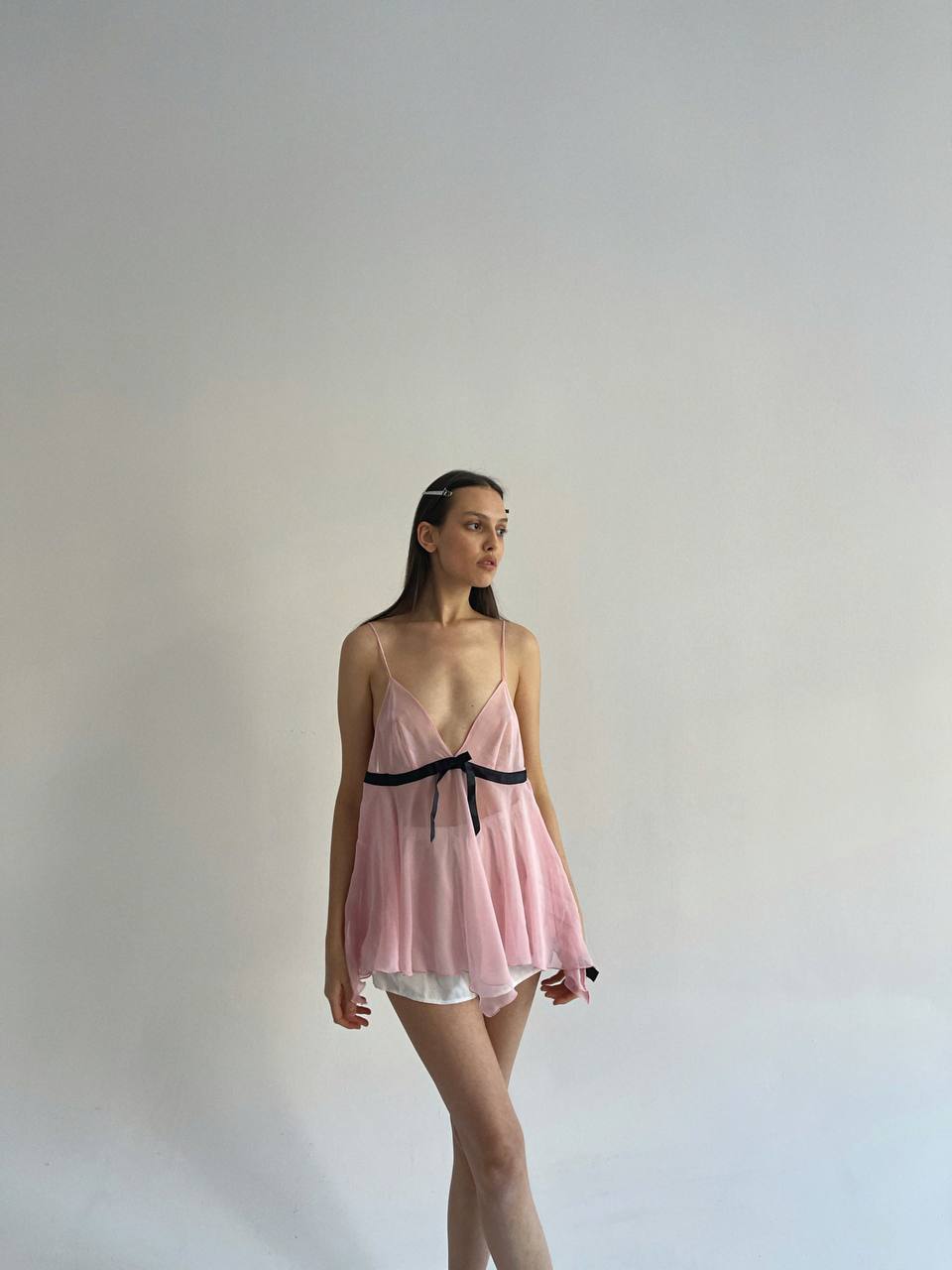 Baby pink sheer cami top with black bow