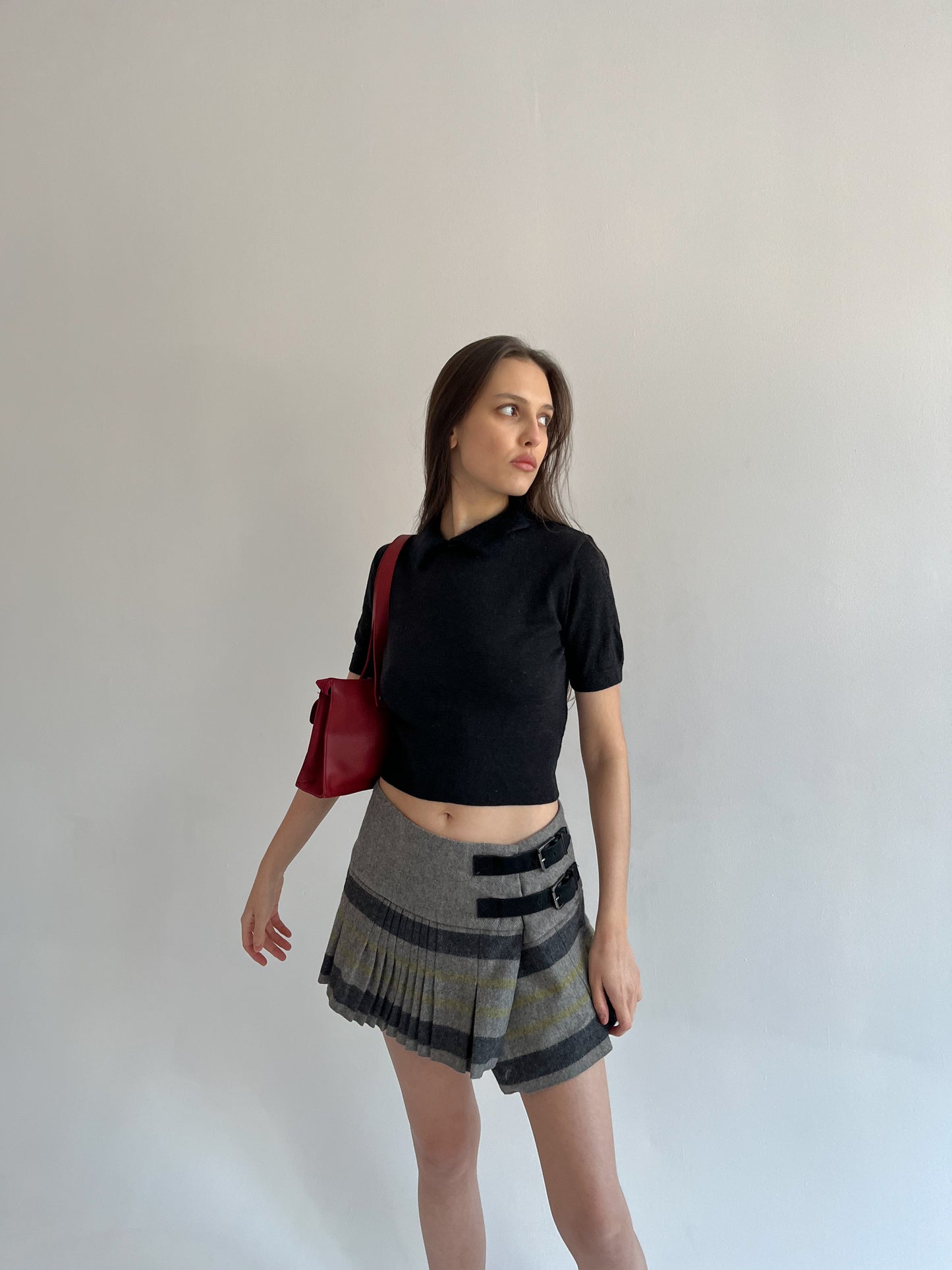 Wool blend pleated mini skirt with side belts detail