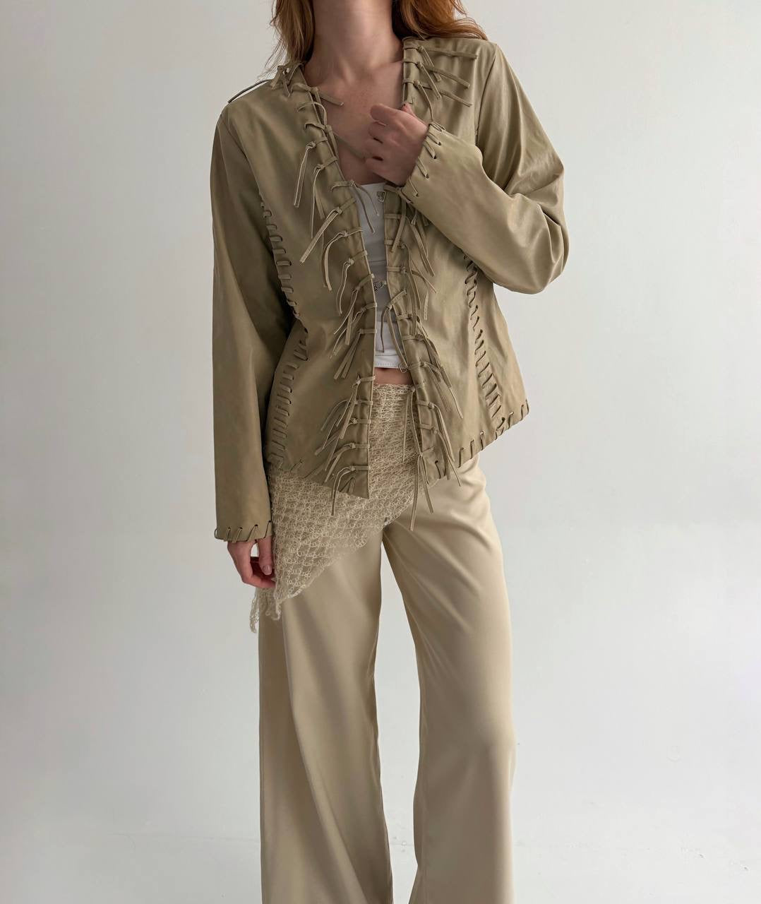 Vintage beige faux leather jacket with fringe detailing