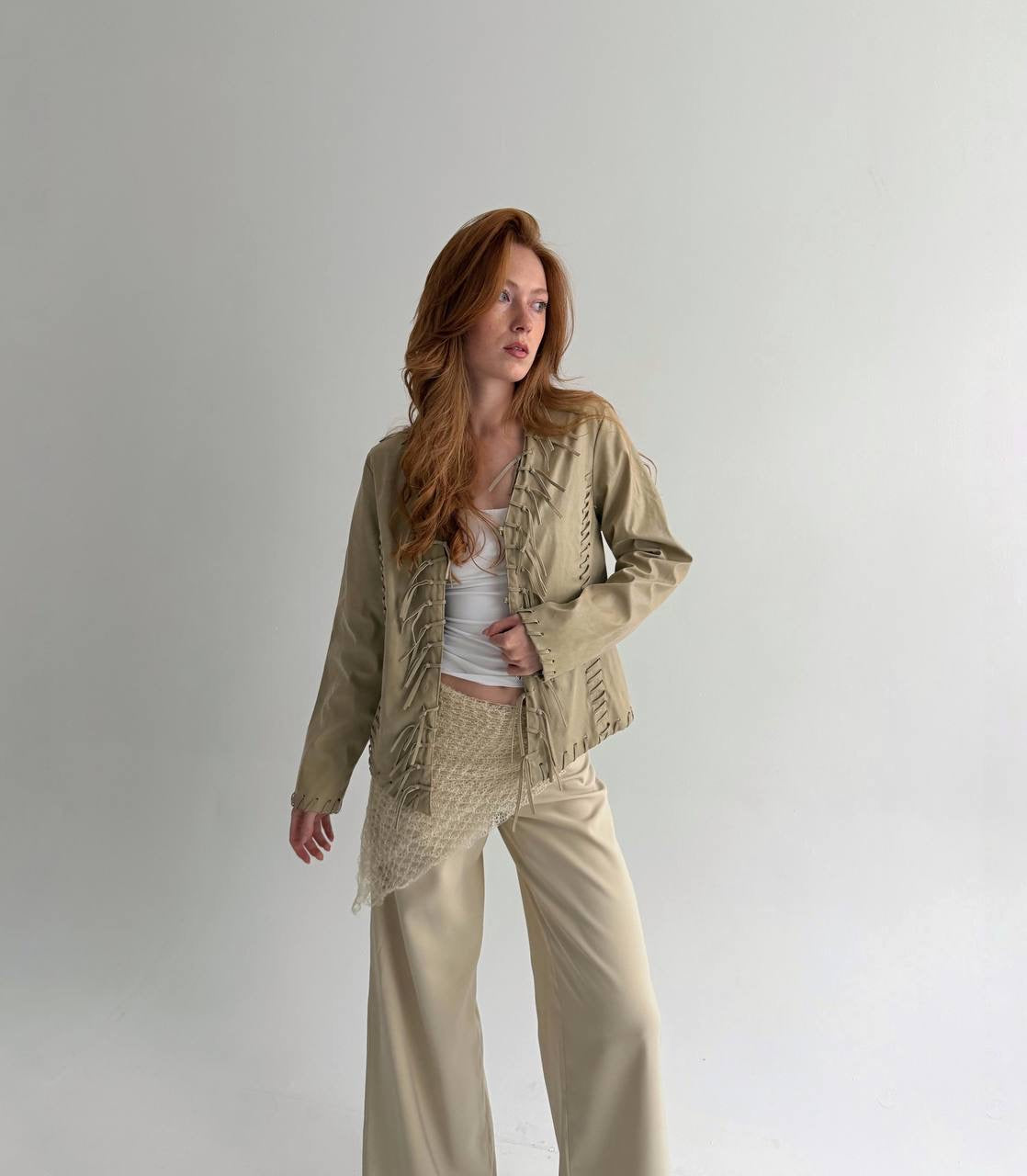 Vintage beige faux leather jacket with fringe detailing