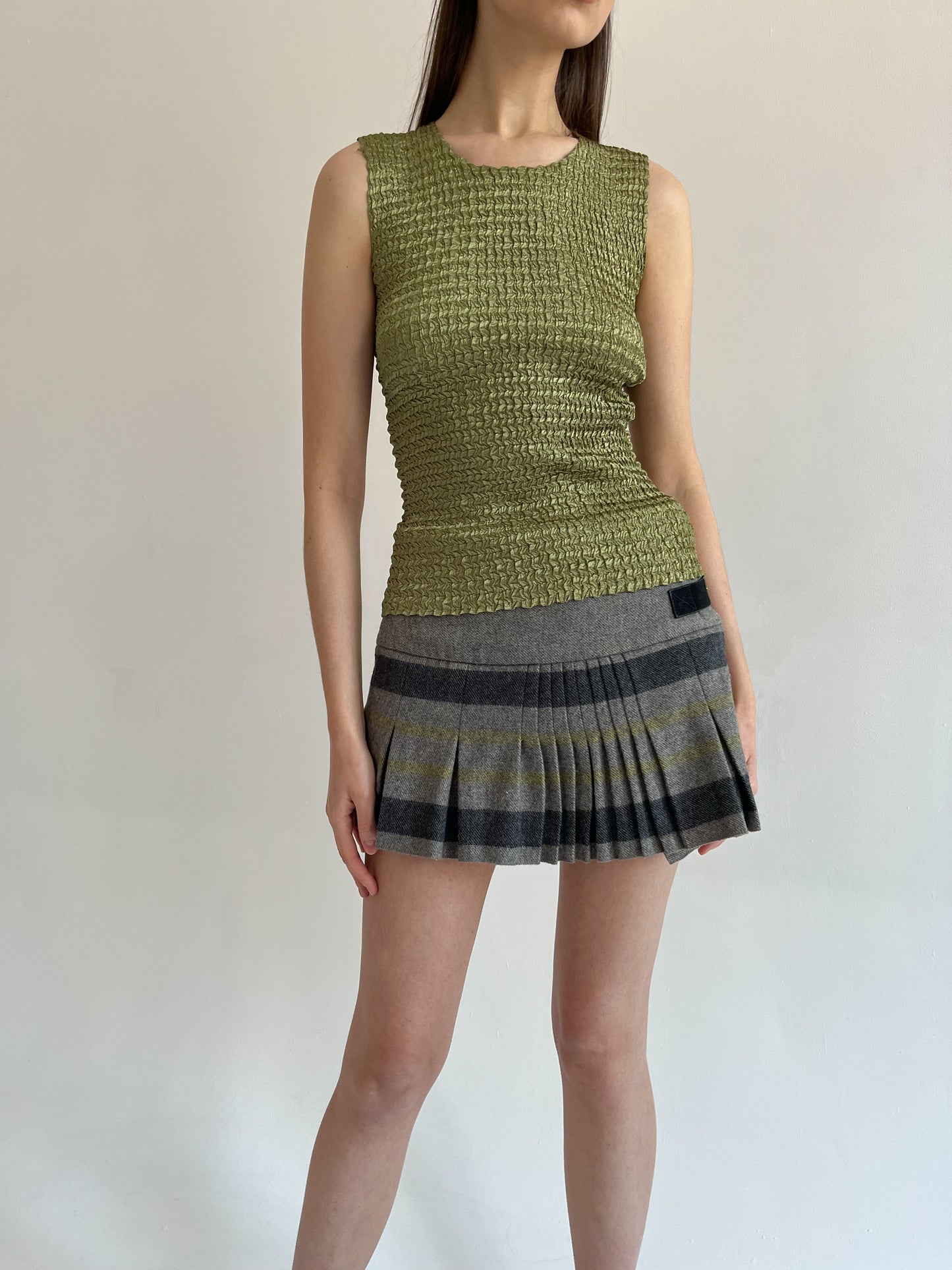 Wool blend pleated mini skirt with side belts detail