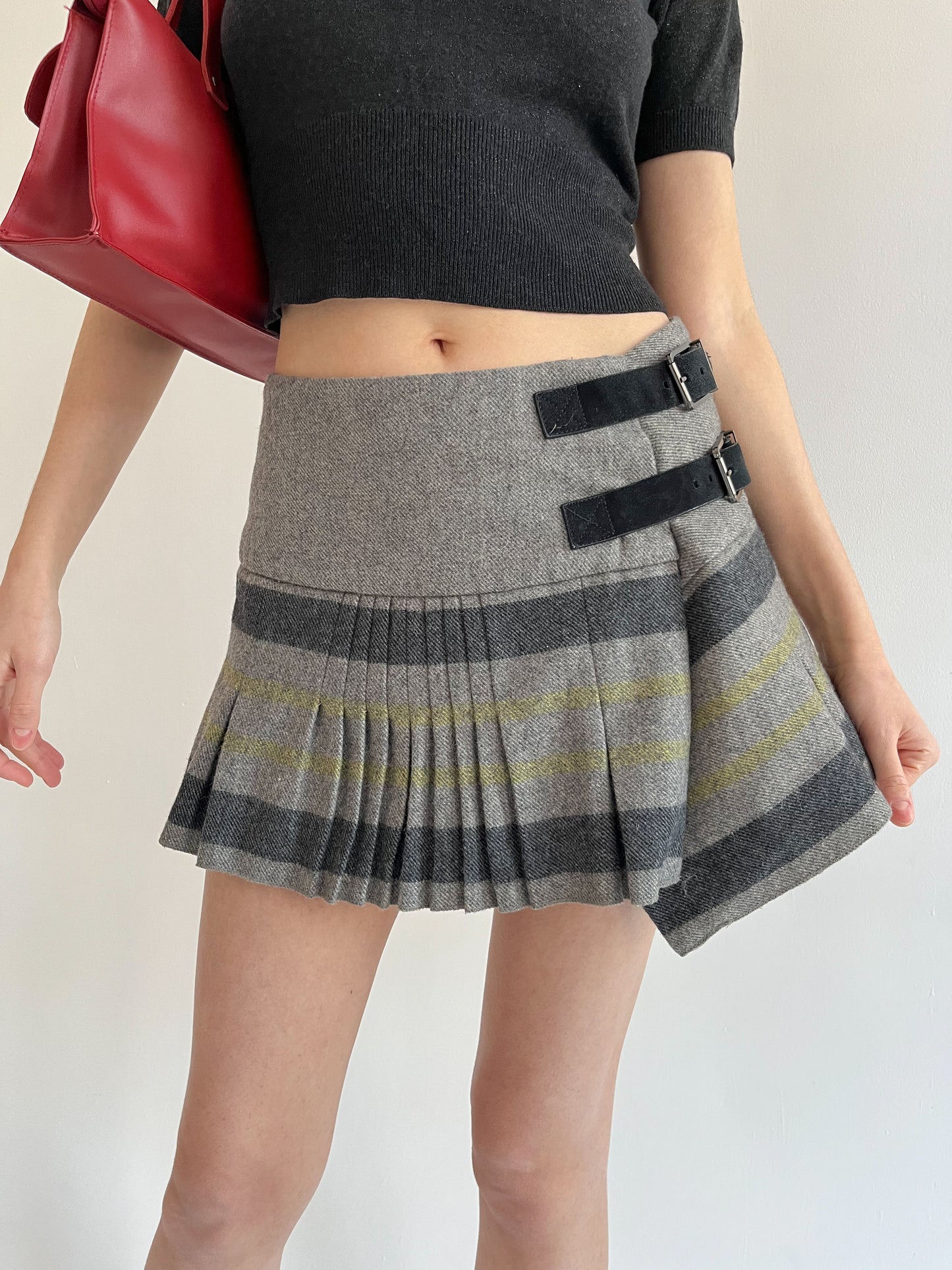 Wool blend pleated mini skirt with side belts detail