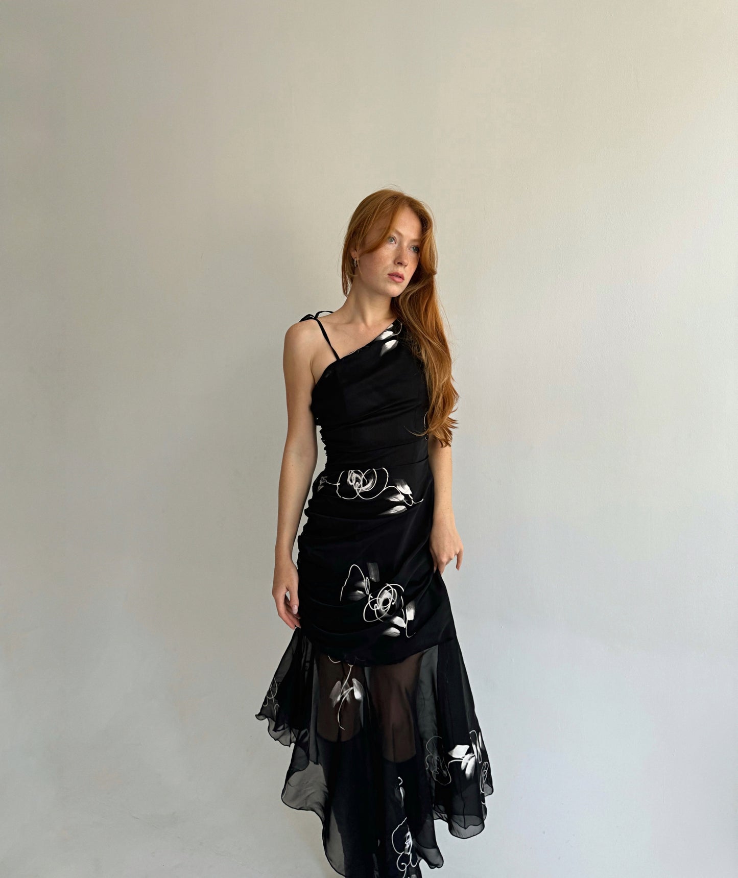 Vintage black asymmetrical maxi dress with a print, gathering and mesh bottom